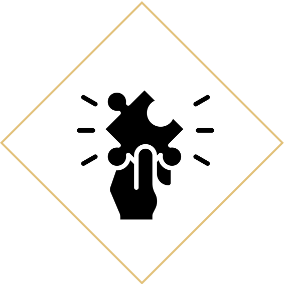 Hand holding puzzle piece, rays around.