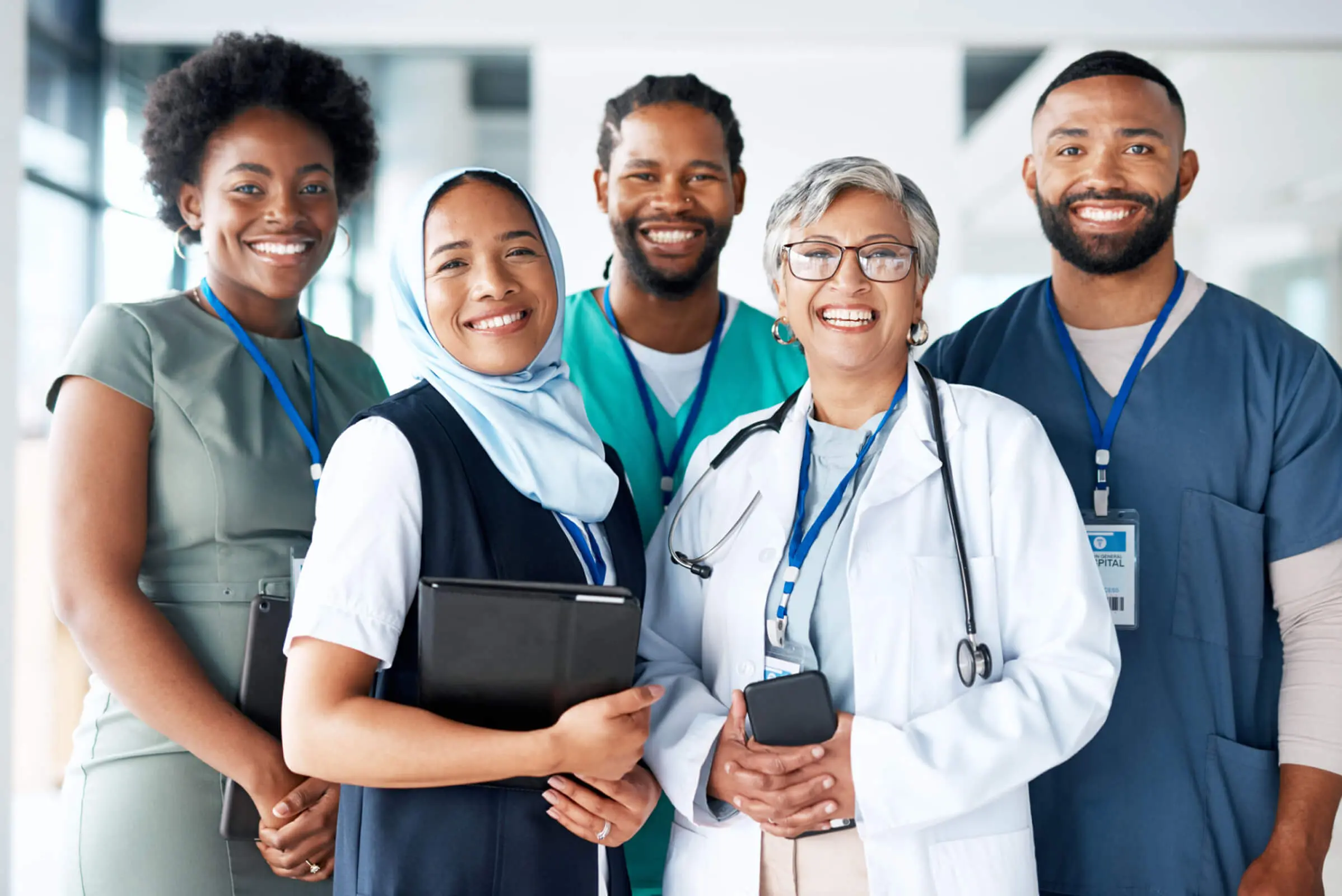 Medical professionals smiling in a group photo.