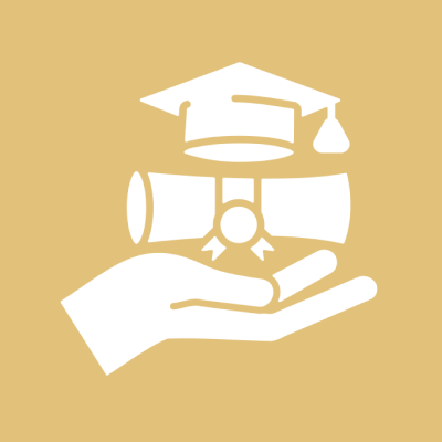 Hand holding diploma and graduation cap.